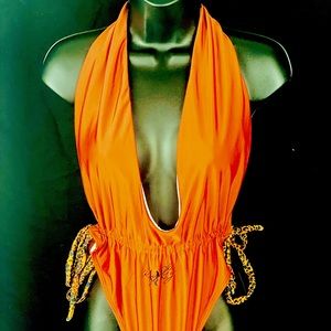 Orange one piece with cheetah print drawstrings deep V neck back out